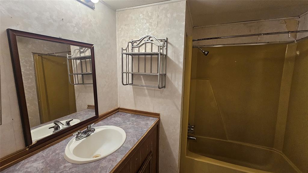 413 Lakeview Trail Weatherford, TX 76087 - Photo 33 of 40 a bathroom with a sink and a mirror