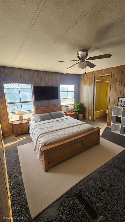 413 Lakeview Trail Weatherford, TX 76087 - Photo 35 of 40 a bedroom with a large bed and a couch