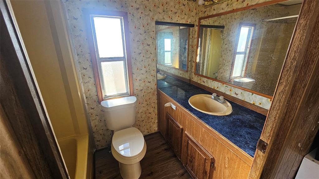 413 Lakeview Trail Weatherford, TX 76087 - Photo 37 of 40 a bathroom with a sink and a mirror