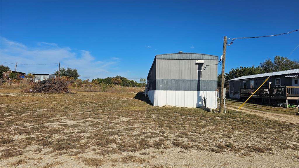 413 Lakeview Trail Weatherford, TX 76087 - Photo 39 of 40 a view of a house with a snow in the background