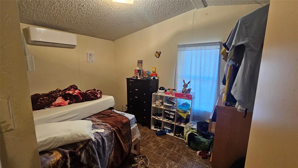 413 Lakeview Trail Weatherford, TX 76087 - Photo 9 of 40 a room with storage and utility