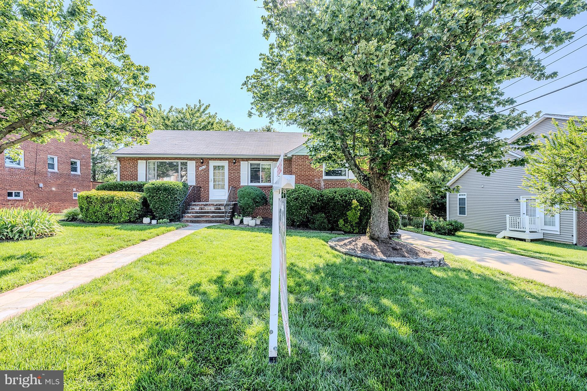 5915 Craig Street Springfield, VA 22150 - Photo 1 of 1 a view of a house with a patio and a yard