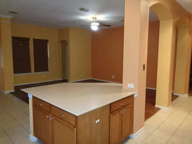 a kitchen with a stove and a refrigerator