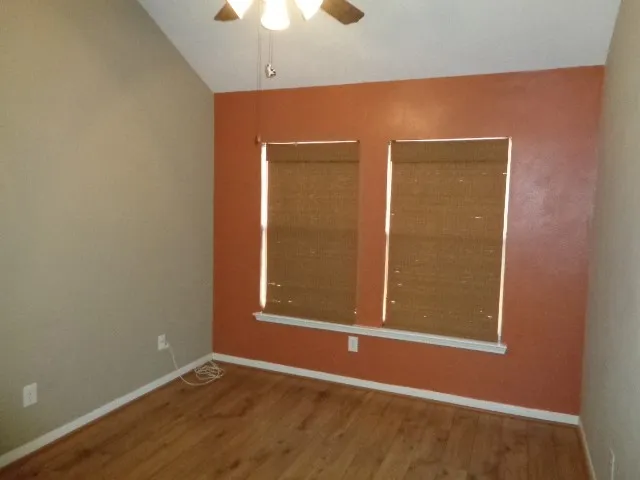 an empty room with a empty space and windows
