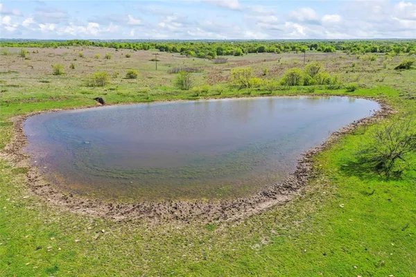 a view of a lake with a building in the background