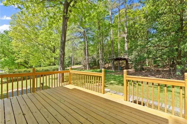 a view of a balcony with wooden floor
