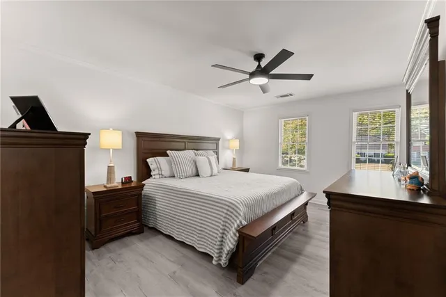 a bedroom with a bed and window