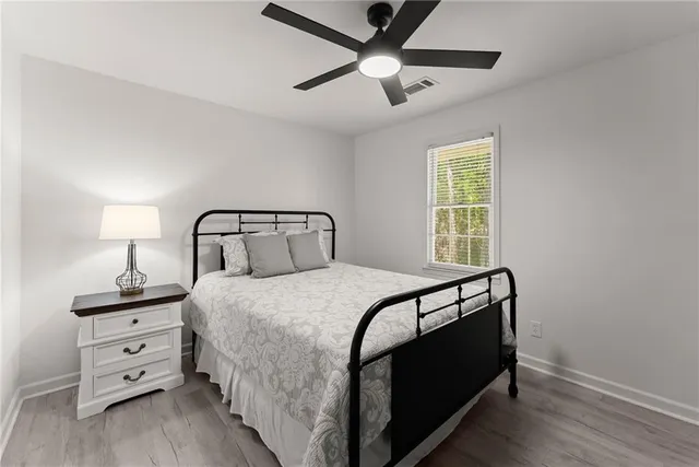 a bedroom with a bed and a closet