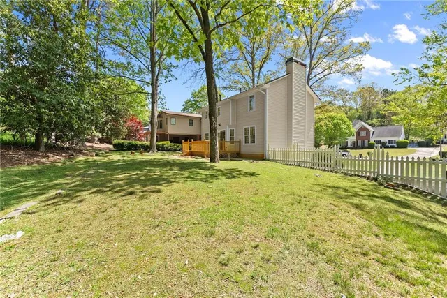 a view of a city with lush green forest