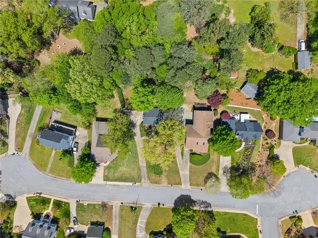 an aerial view of a residential apartment building with a yard