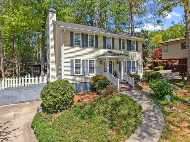 a front view of a house with garden