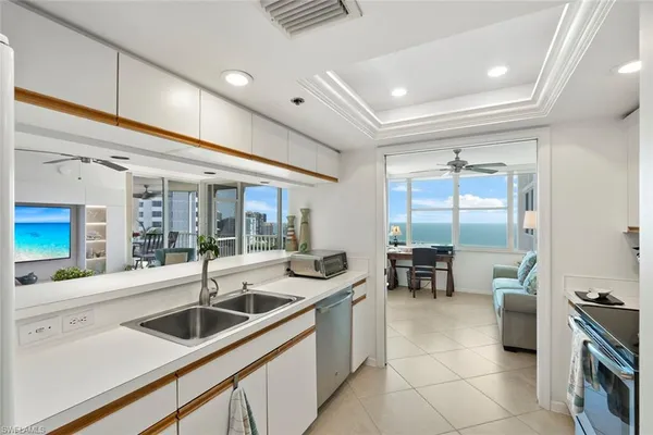 a kitchen with stainless steel appliances a stove a microwave and a refrigerator