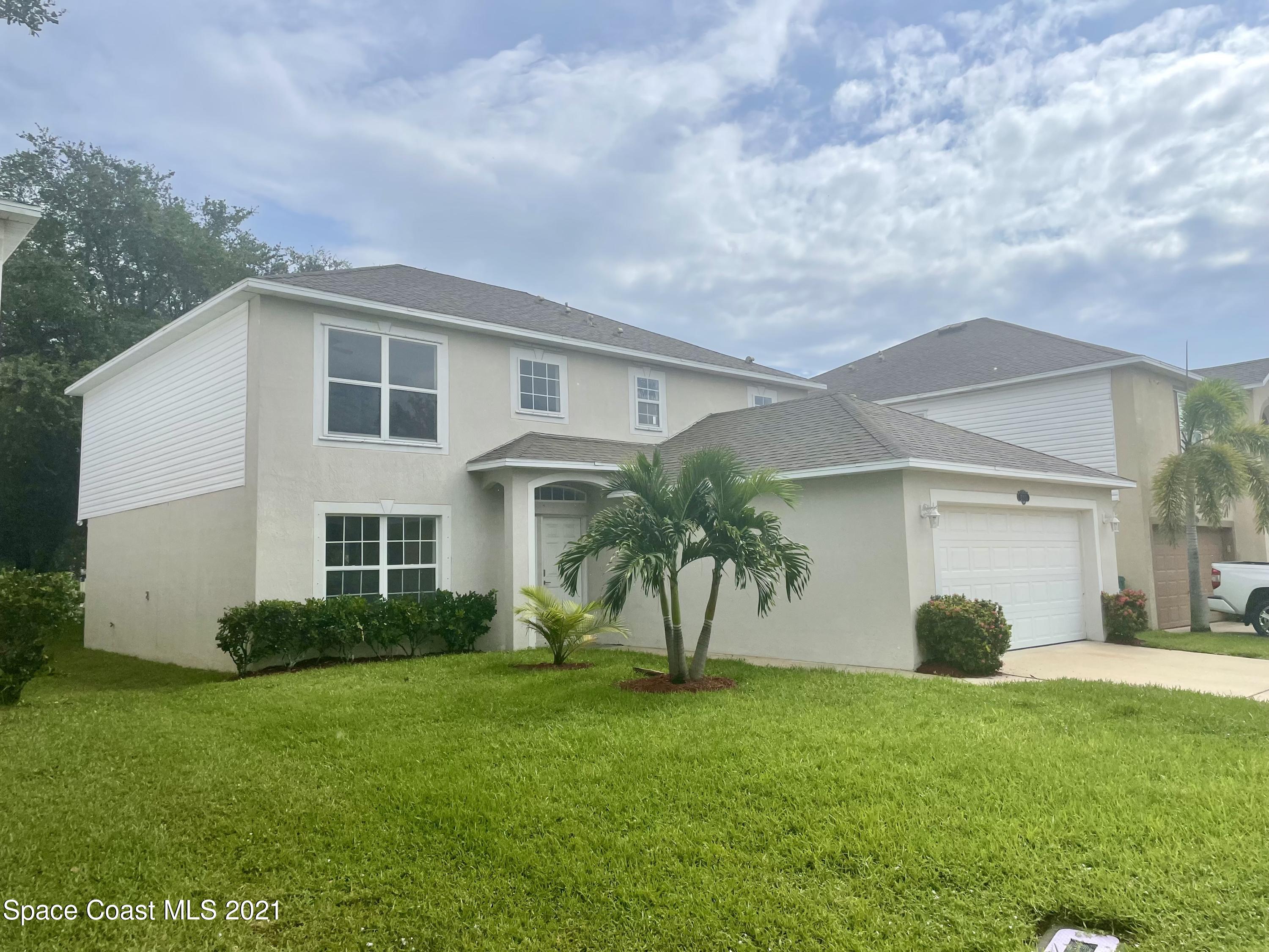 2315 Canopy Drive Melbourne, FL 32935 - Photo 2 of 27 a view of a house with a backyard