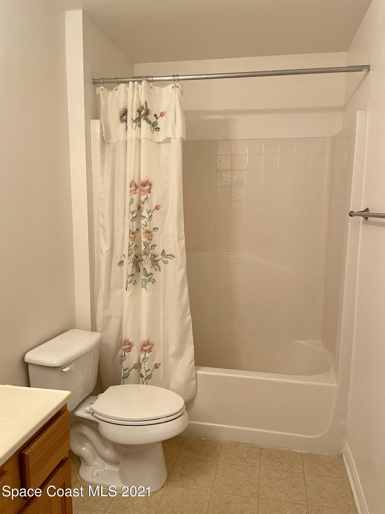 2315 Canopy Drive Melbourne, FL 32935 - Photo 20 of 27 a bathroom with a toilet and shower