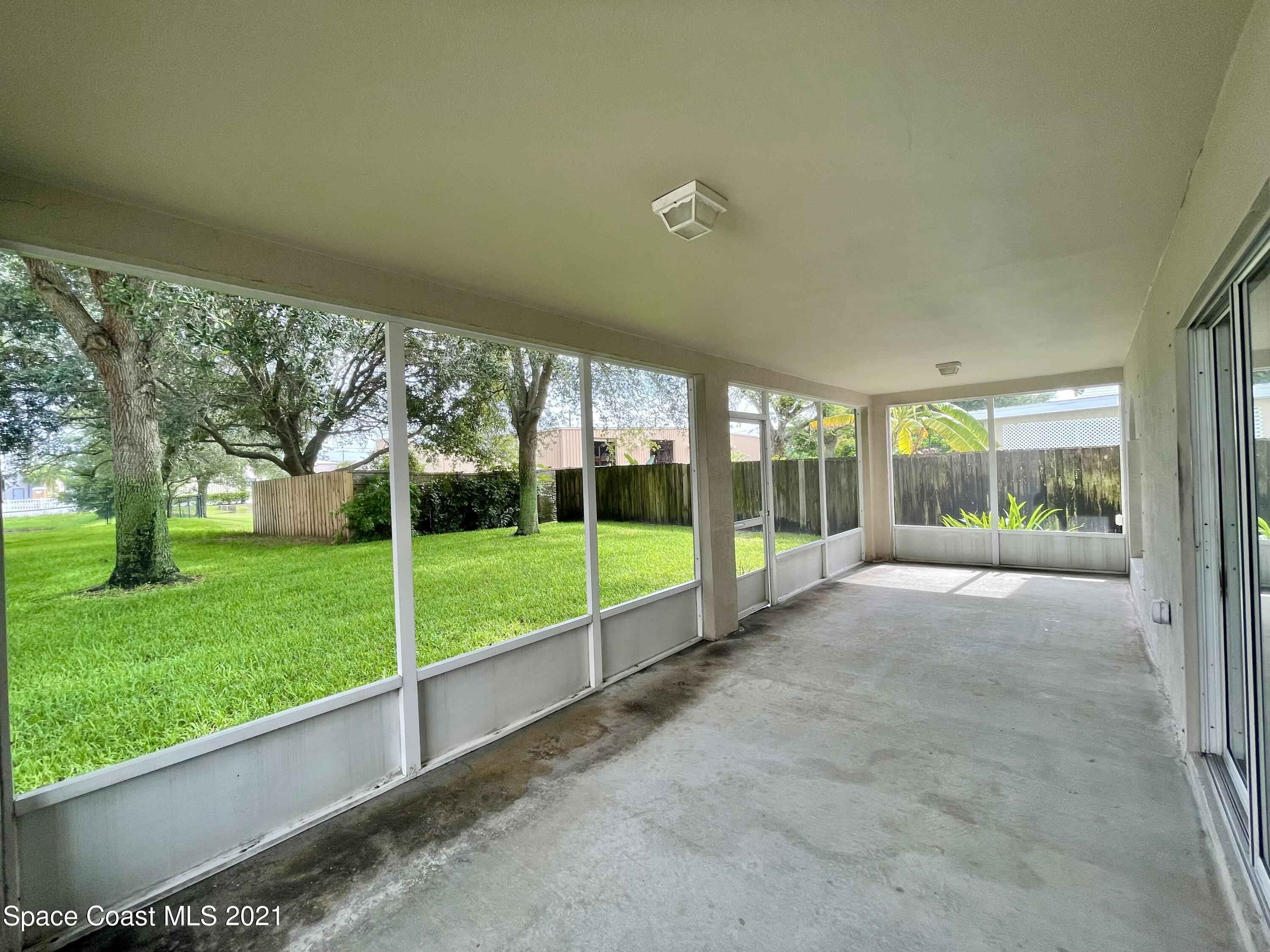 2315 Canopy Drive Melbourne, FL 32935 - Photo 24 of 27 a view of a garden with an outdoor seating