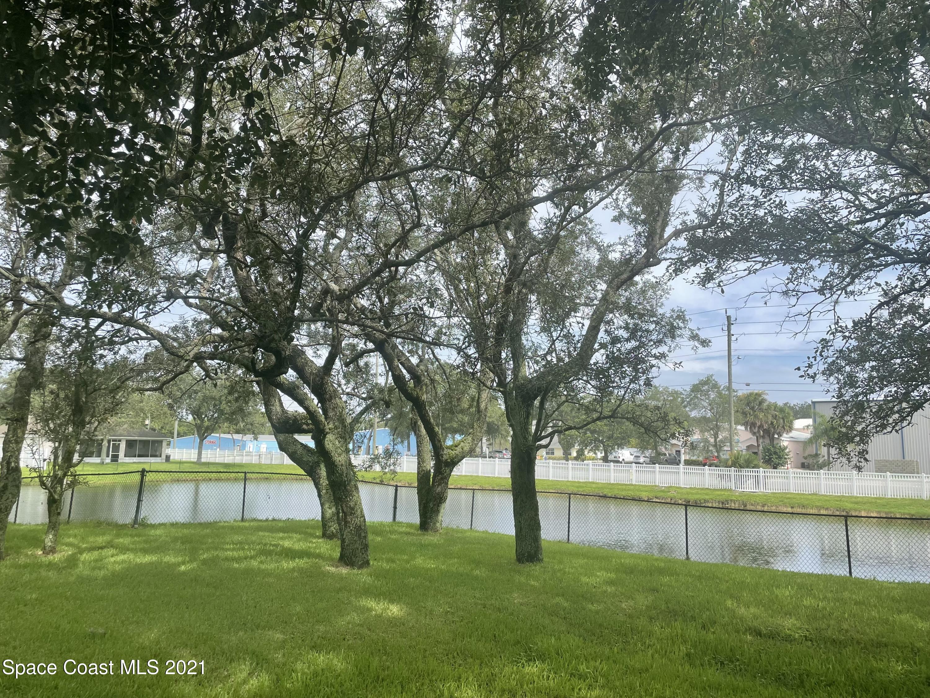 2315 Canopy Drive Melbourne, FL 32935 - Photo 25 of 27 a view of an outdoor space and a lake view
