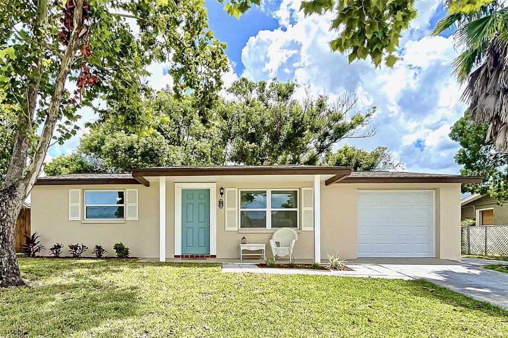 9120 Chatam Lane Port Richey, FL 34668 - Photo 1 of 1 front view of a house with a yard