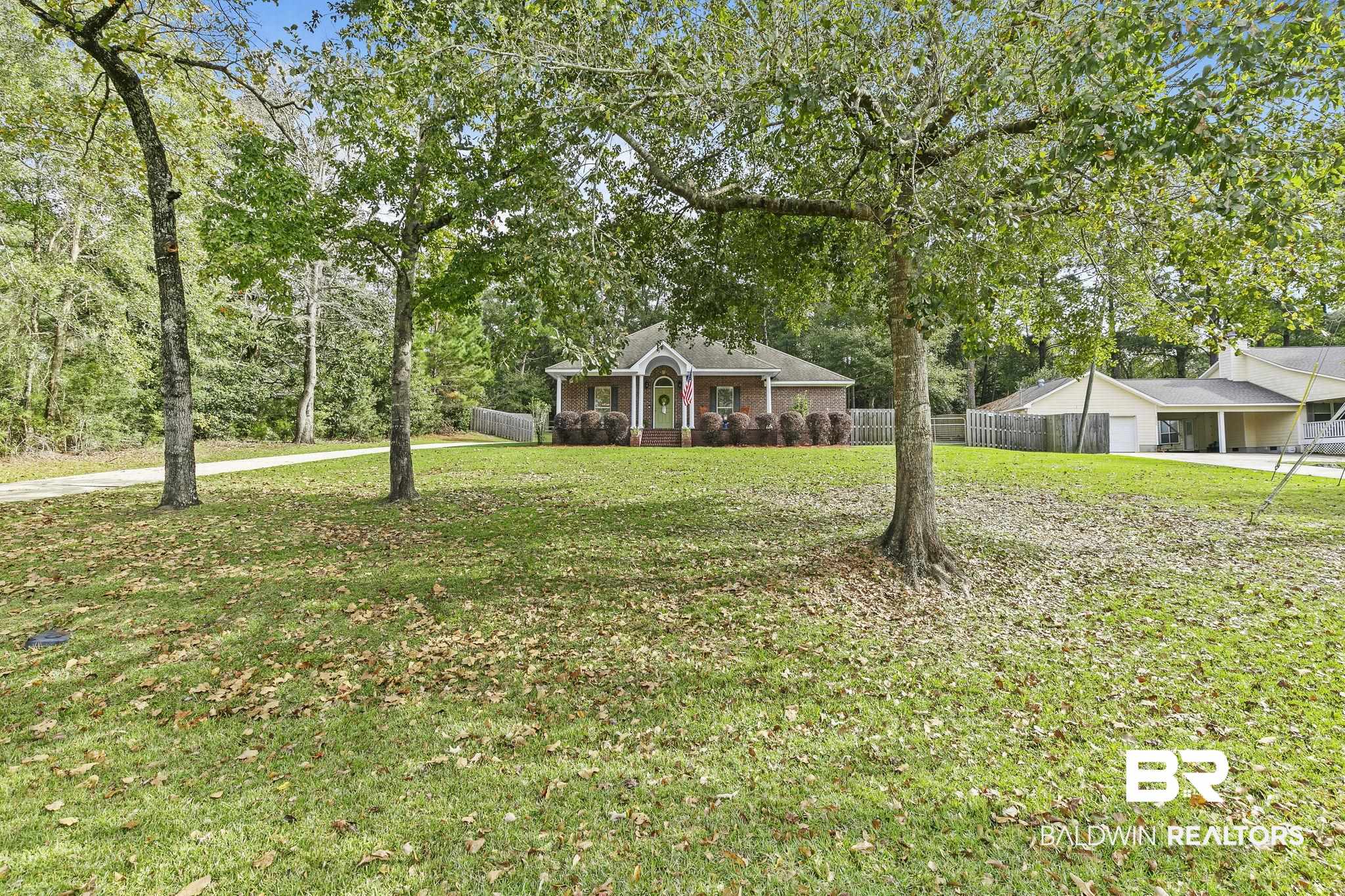32072 Buzbee Road Daphne, AL 36527 - Photo 3 of 41 View of front of house featuring a front lawn