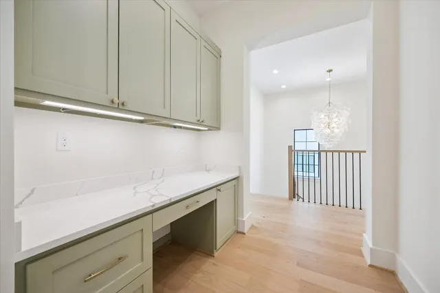 a view of cabinets and wooden floor