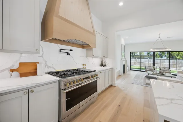 a kitchen with a stove a sink and a refrigerator