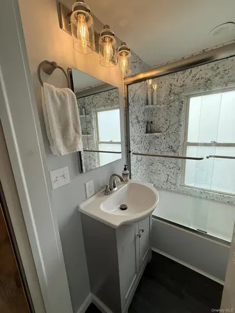 a white toilet sitting next to a bathroom sink