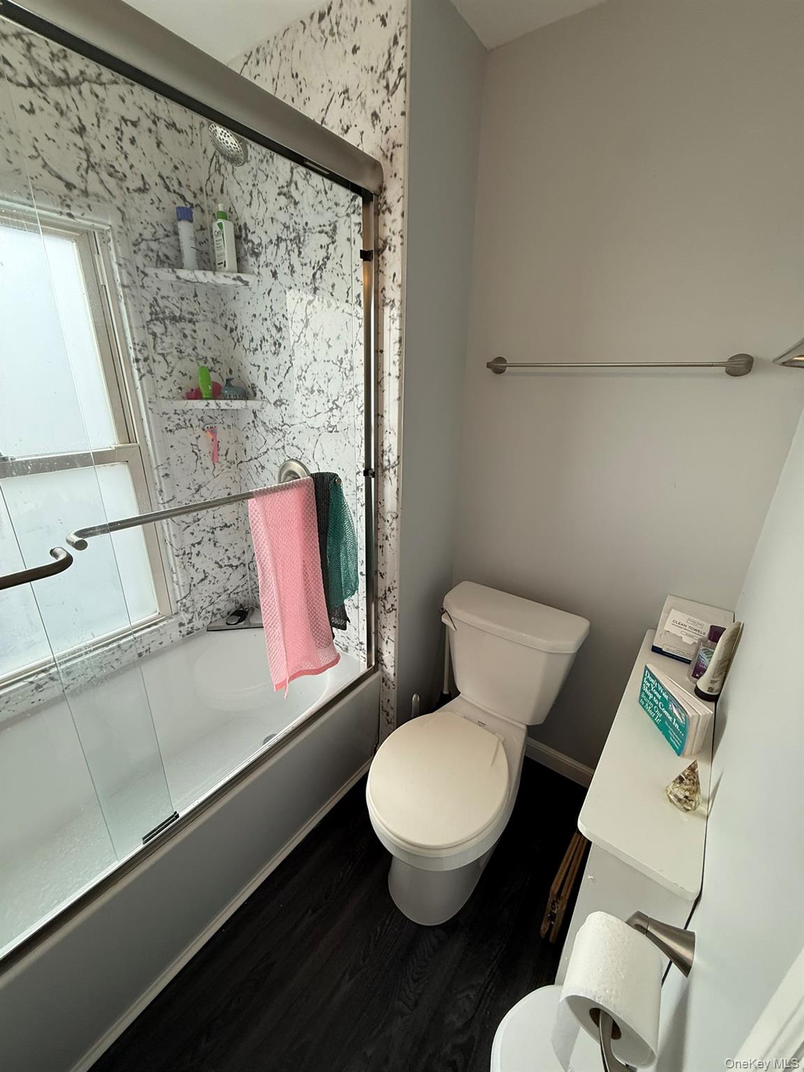 22 Church Street Beacon, NY 12508 - Photo 17 of 25 a white toilet sitting next to a bathroom sink