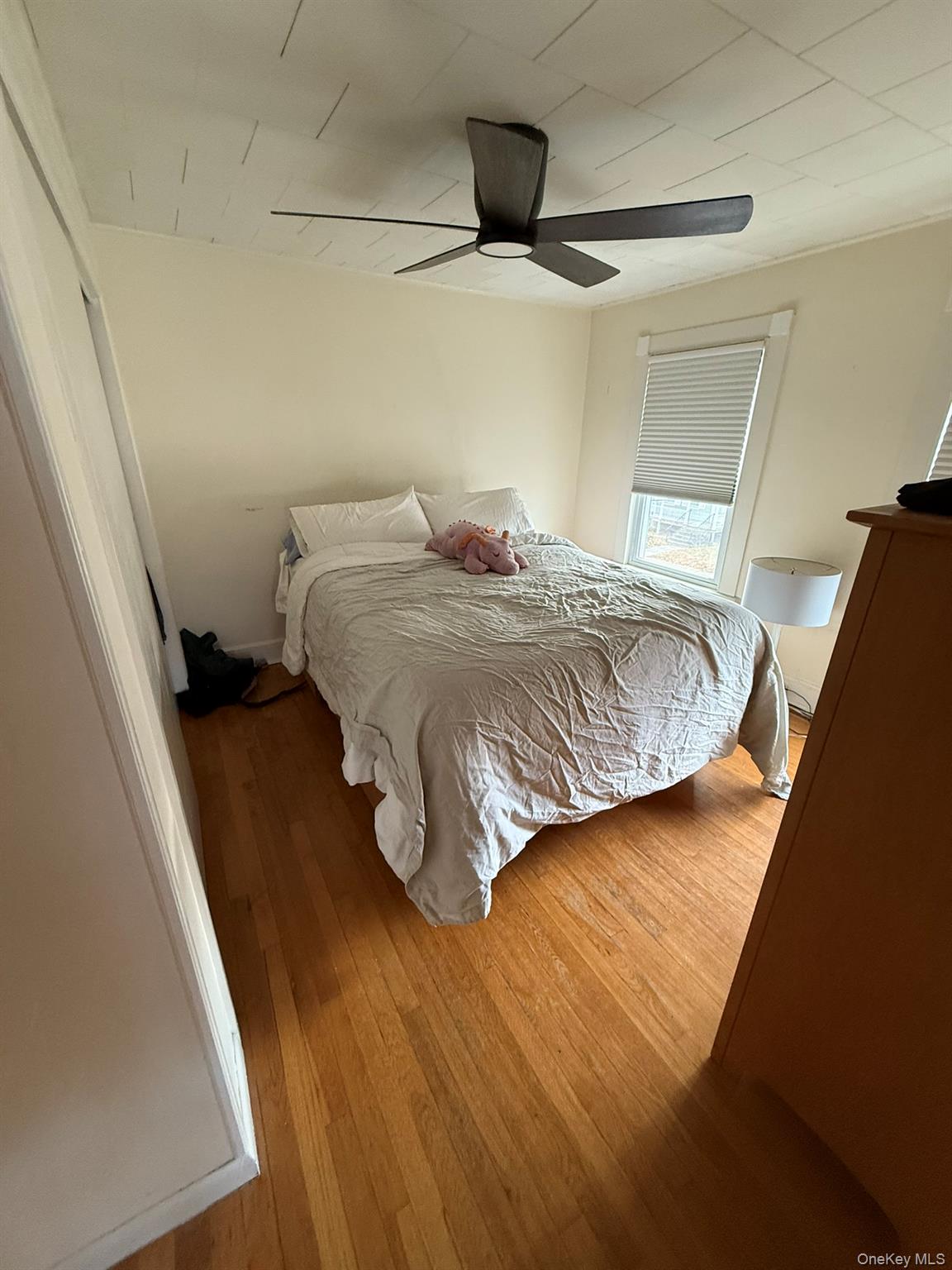 22 Church Street Beacon, NY 12508 - Photo 19 of 25 a bedroom with a bed and wooden floor