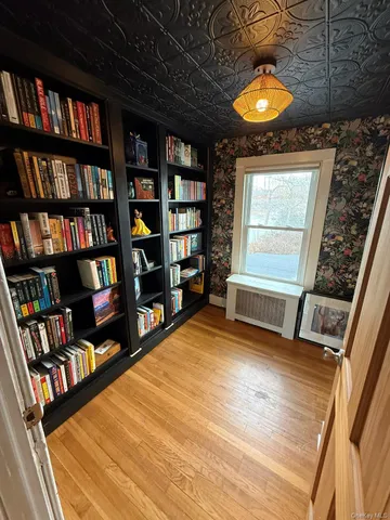 a room with water heater and wooden floor