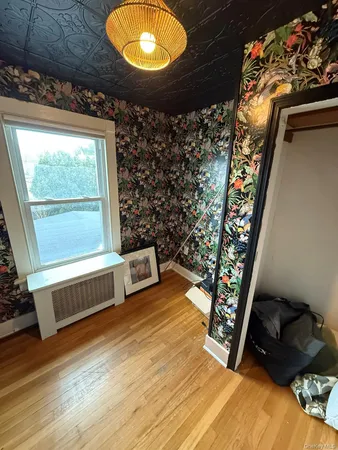 a room with furniture and a mirror