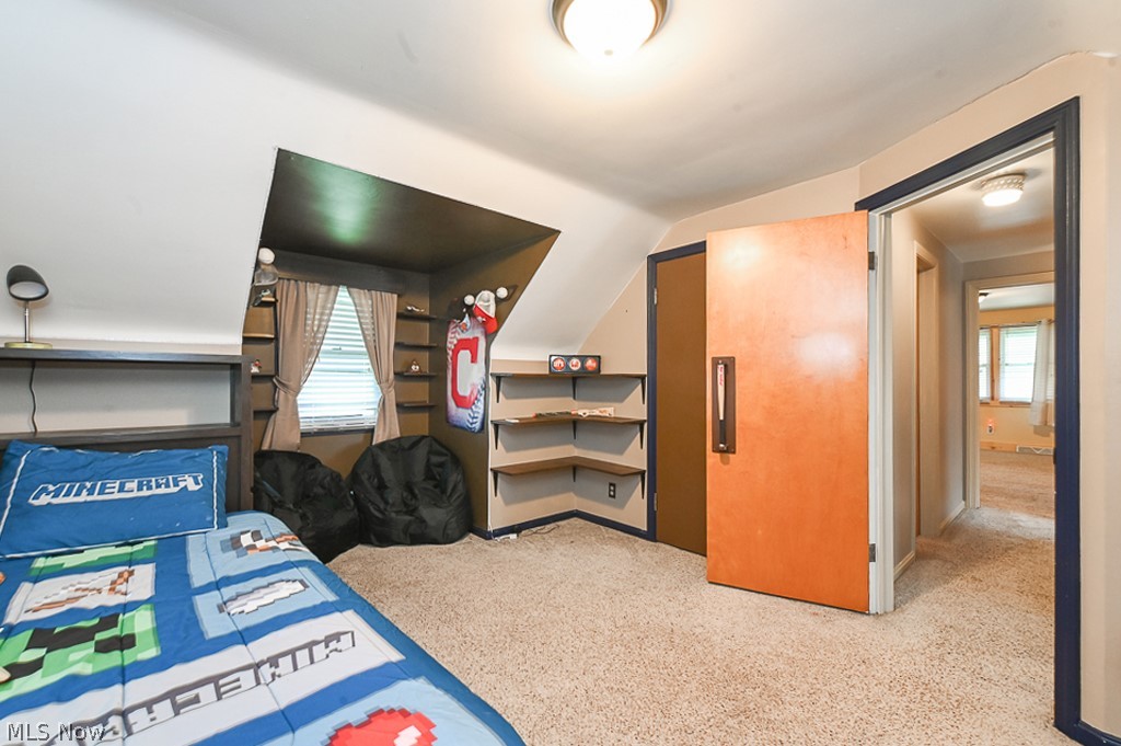 2819 Mayfair Road Akron, OH 44312 - Photo 21 of 49 Bedroom with vaulted ceiling and light carpet