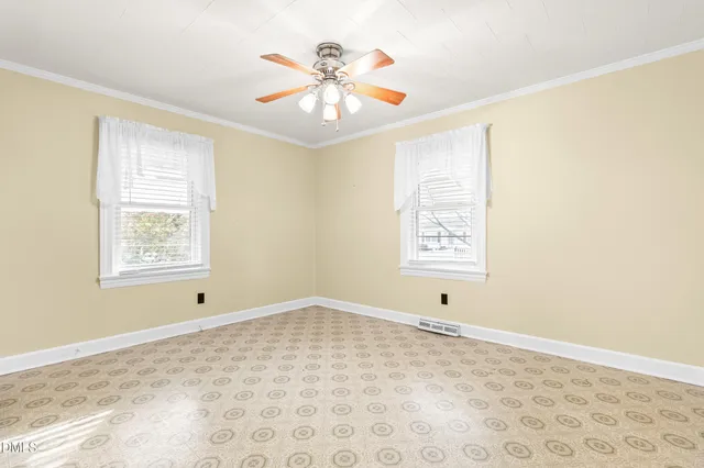 a view of room with window and ceiling fan