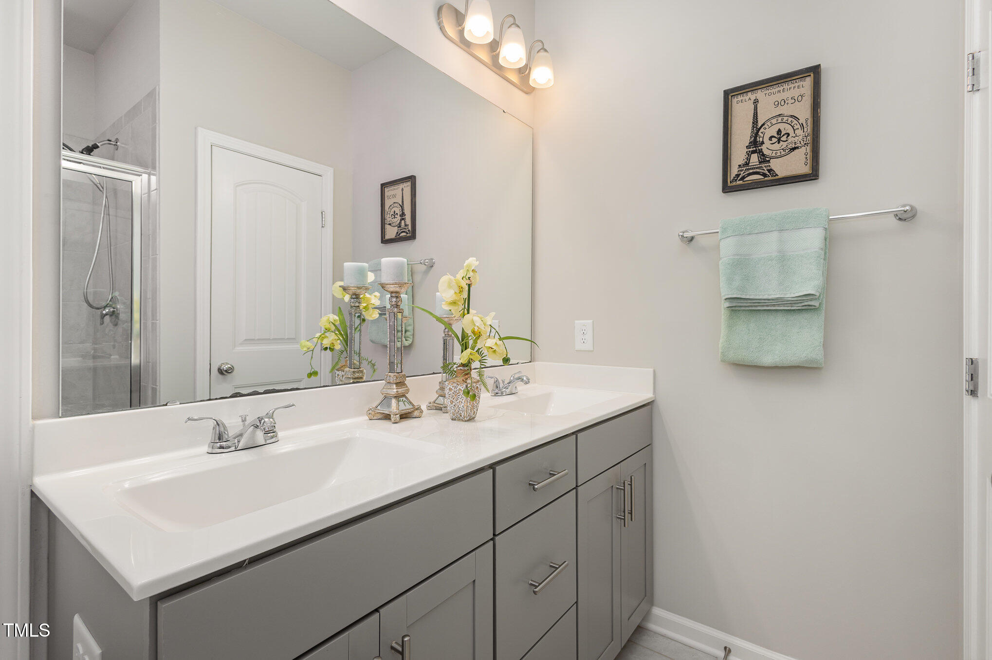 131 Kinnakeet Drive Durham, NC 27704 - Photo 12 of 18 a bathroom with a sink and a mirror