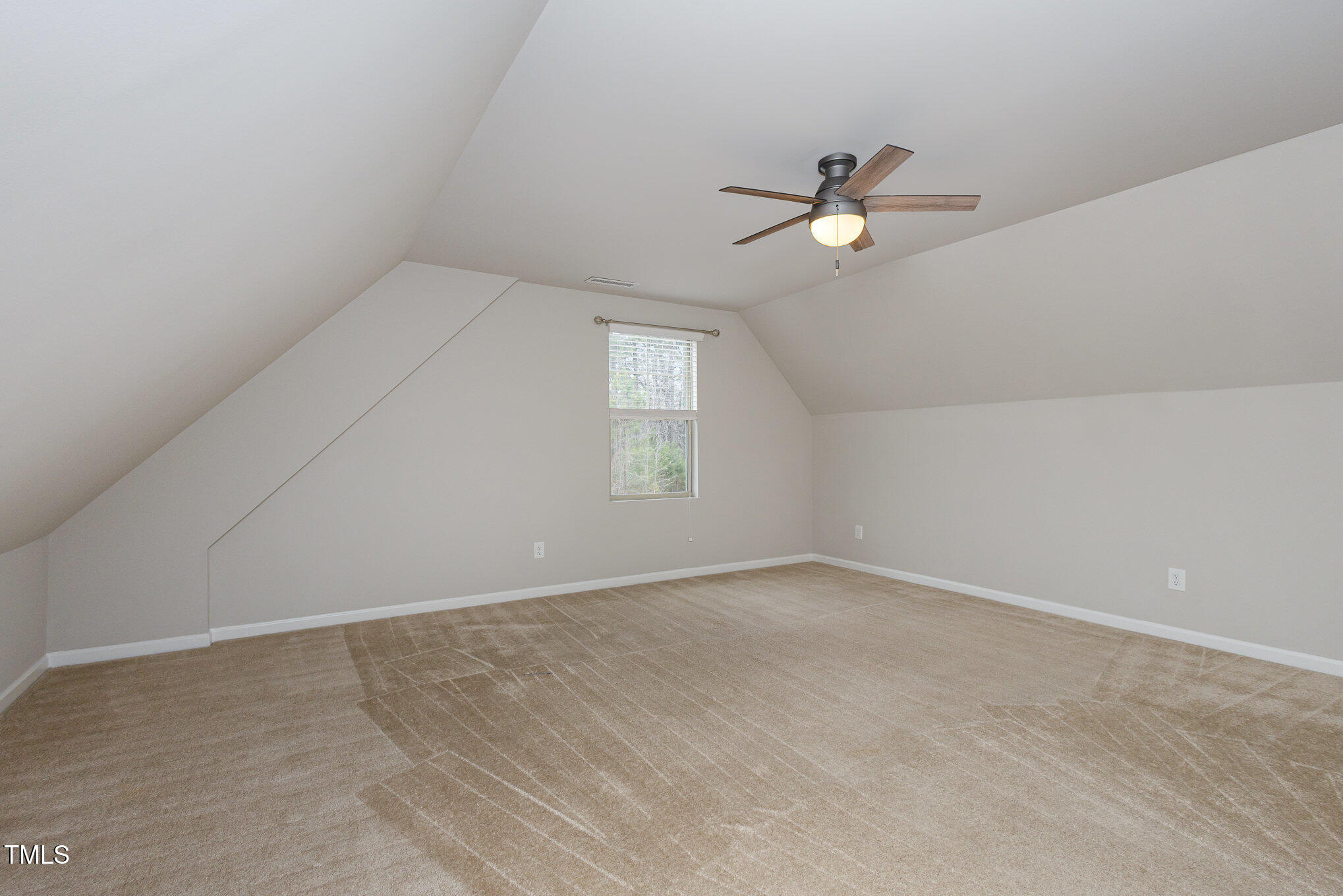 131 Kinnakeet Drive Durham, NC 27704 - Photo 13 of 18 an empty room with ceiling fan and window