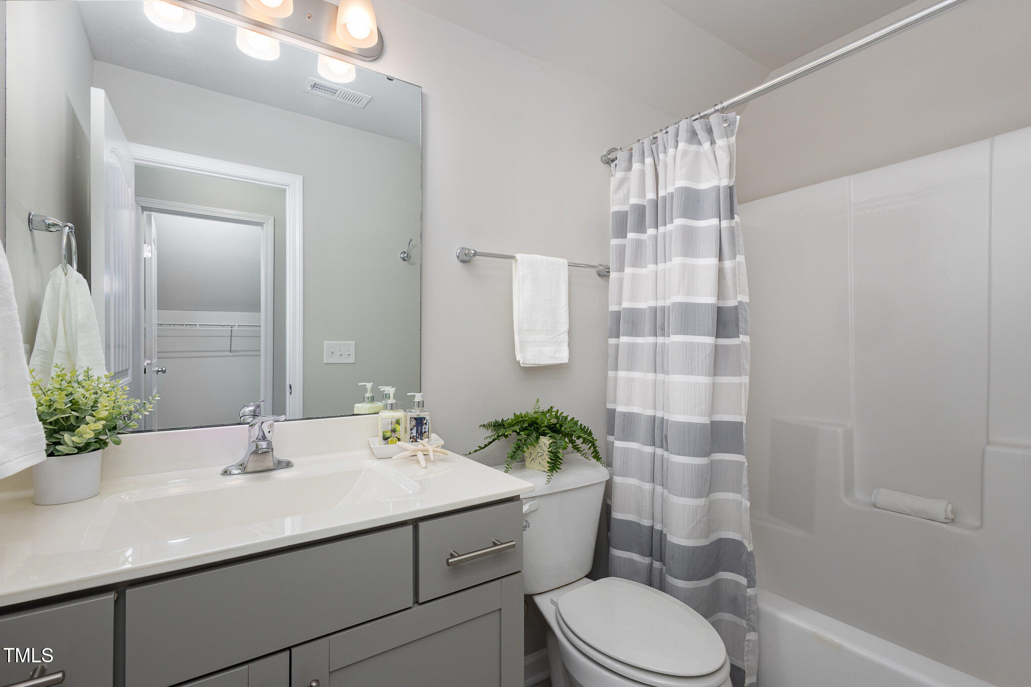 131 Kinnakeet Drive Durham, NC 27704 - Photo 14 of 18 a bathroom with a sink toilet and shower