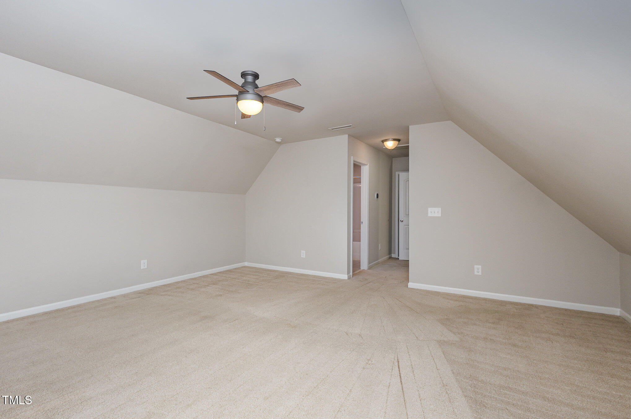 131 Kinnakeet Drive Durham, NC 27704 - Photo 15 of 18 an empty room with fan and a ceiling fan