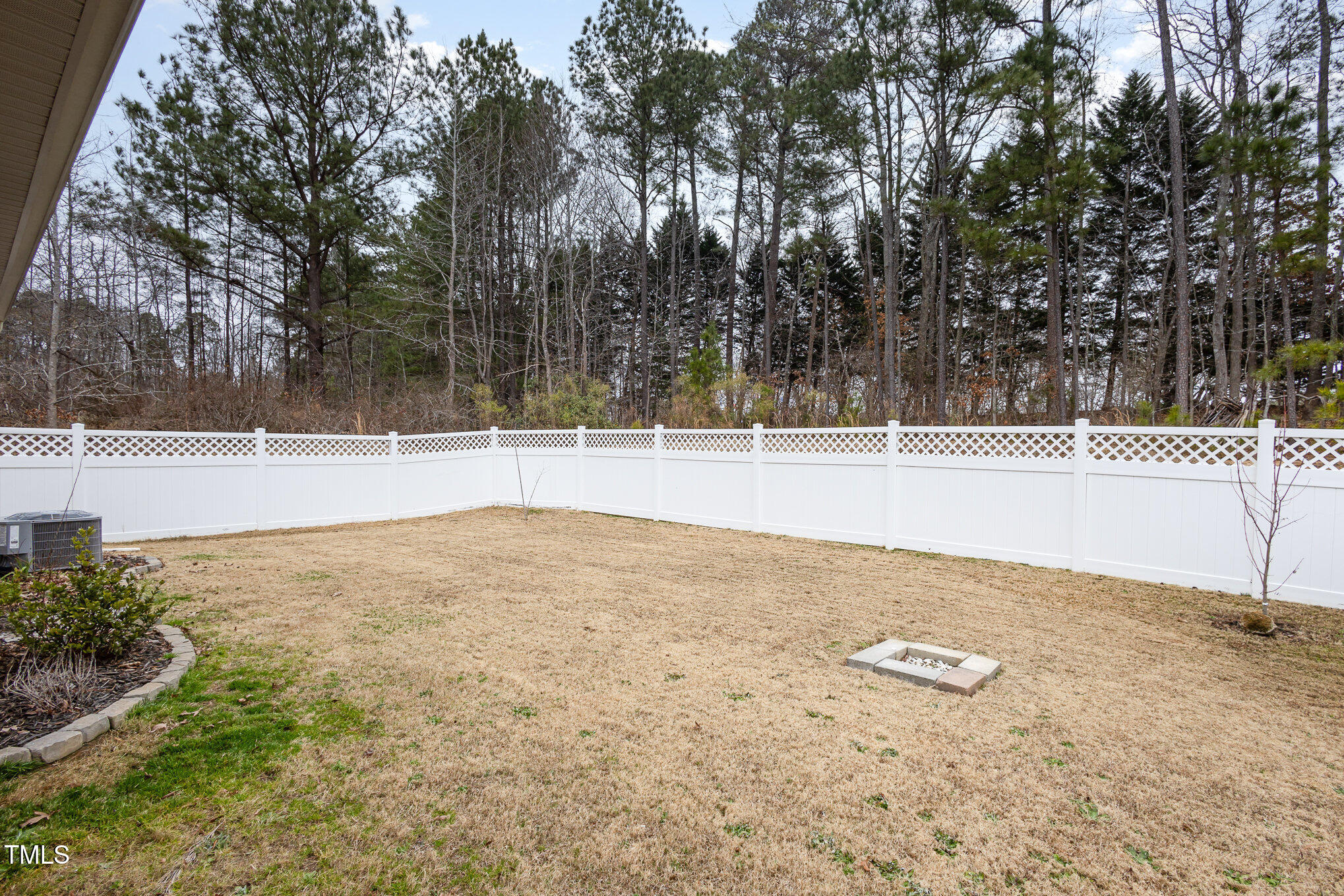 131 Kinnakeet Drive Durham, NC 27704 - Photo 16 of 18 a view of a dry yard with wooden fence