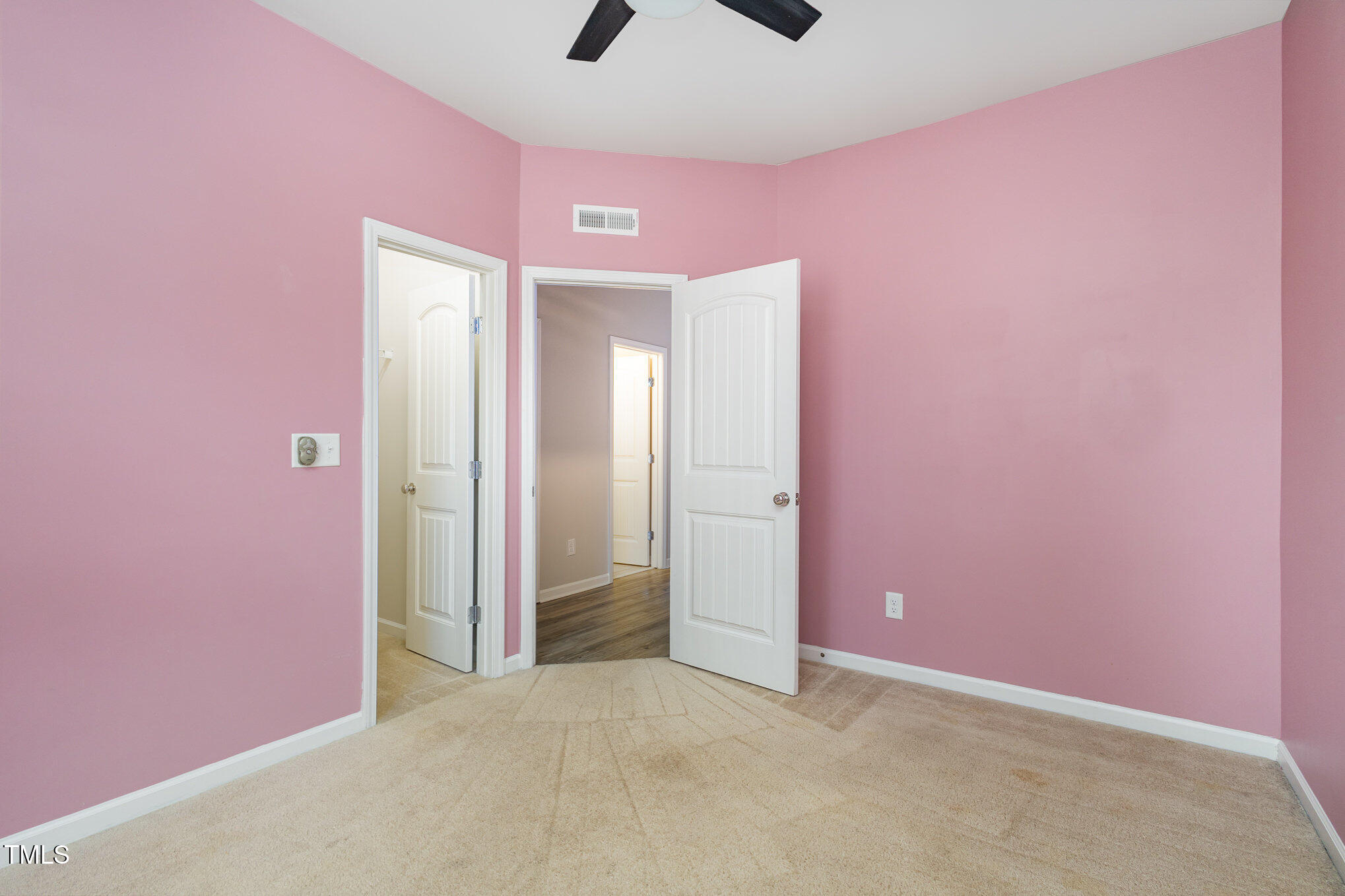 131 Kinnakeet Drive Durham, NC 27704 - Photo 10 of 18 an empty room with closet and a chandelier fan