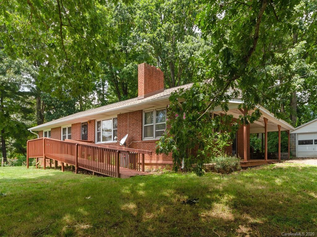 124 Trantham Road Canton, NC 28716 - Photo 1 of 18 a view of backyard with deck and deck