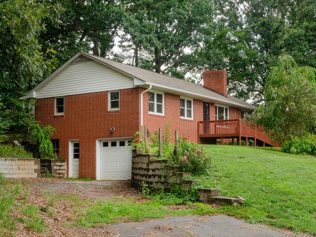 124 Trantham Road Canton, NC 28716 - Photo 17 of 18 a front view of a house with a yard and trees