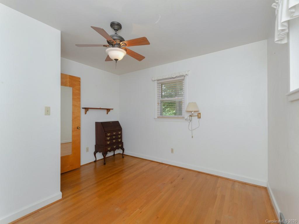 124 Trantham Road Canton, NC 28716 - Photo 7 of 18 a view of a livingroom with a ceiling fan and wooden floor