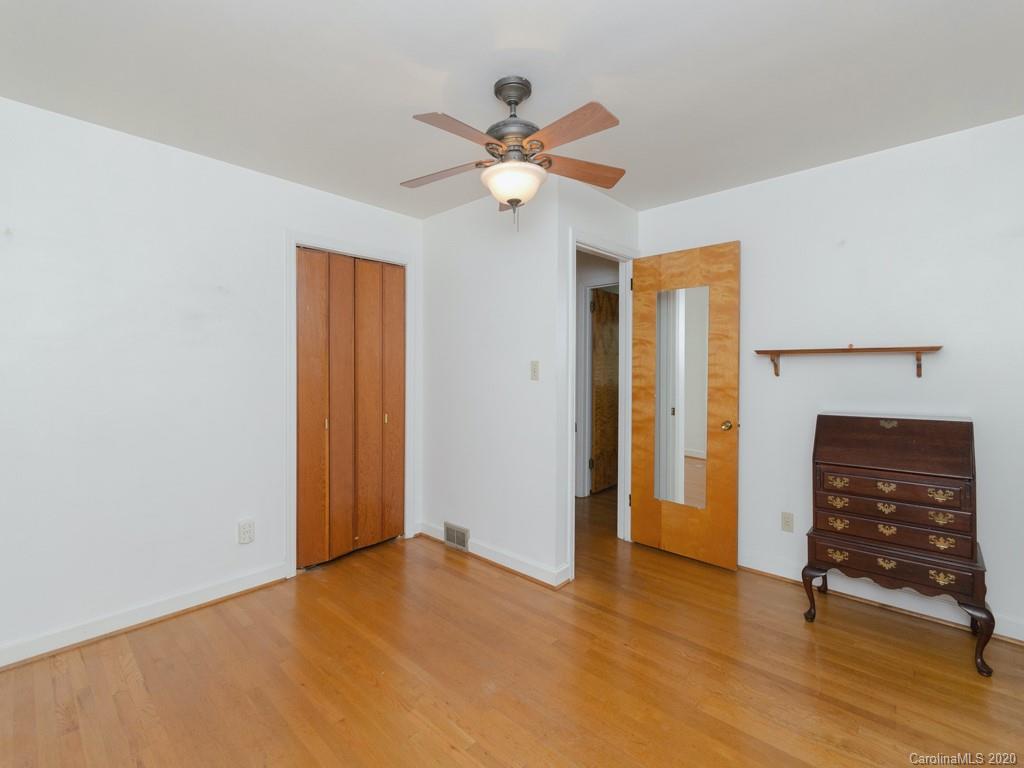 124 Trantham Road Canton, NC 28716 - Photo 8 of 18 a view of an empty room with window and a ceiling fan