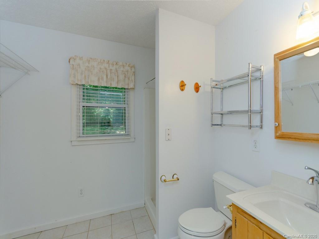 124 Trantham Road Canton, NC 28716 - Photo 9 of 18 a bathroom with a sink toilet and mirror
