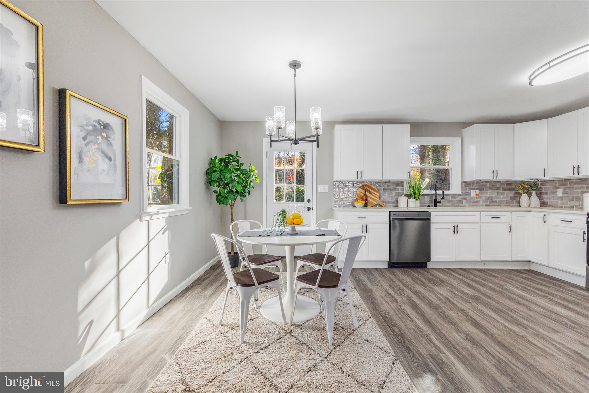 712 St Marys Road Pylesville, MD 21132 - Photo 11 of 43 a kitchen with a dining table chairs and white cabinets