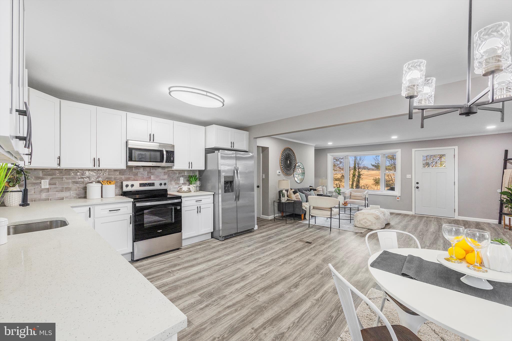 712 St Marys Road Pylesville, MD 21132 - Photo 5 of 43 a kitchen with stainless steel appliances granite countertop a refrigerator and stove top oven