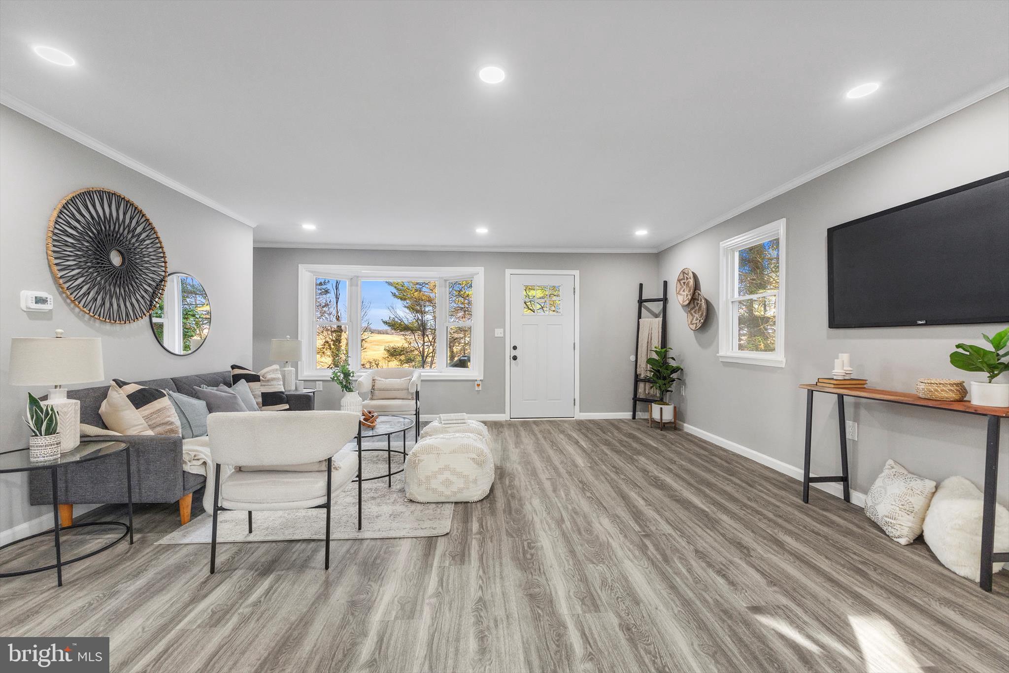 712 St Marys Road Pylesville, MD 21132 - Photo 6 of 43 a living room with furniture and a flat screen tv