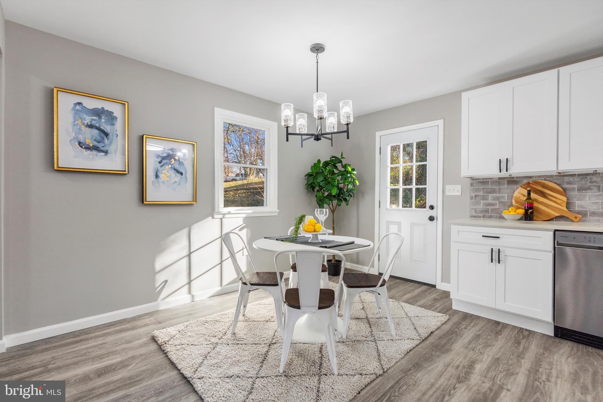712 St Marys Road Pylesville, MD 21132 - Photo 10 of 43 a living room with furniture and a chandelier