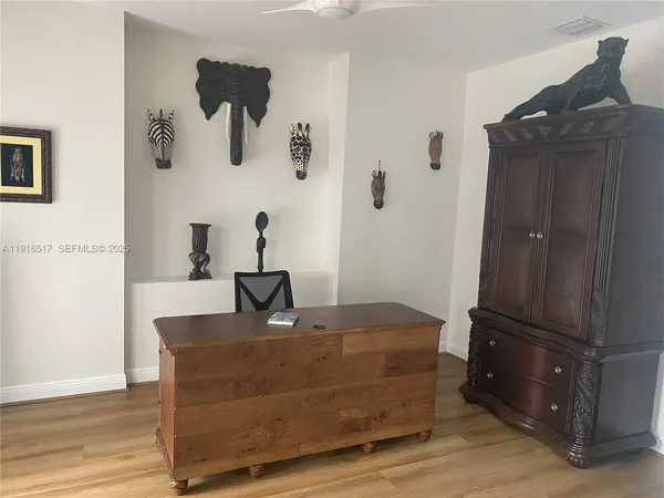 a room with a table and a mirror