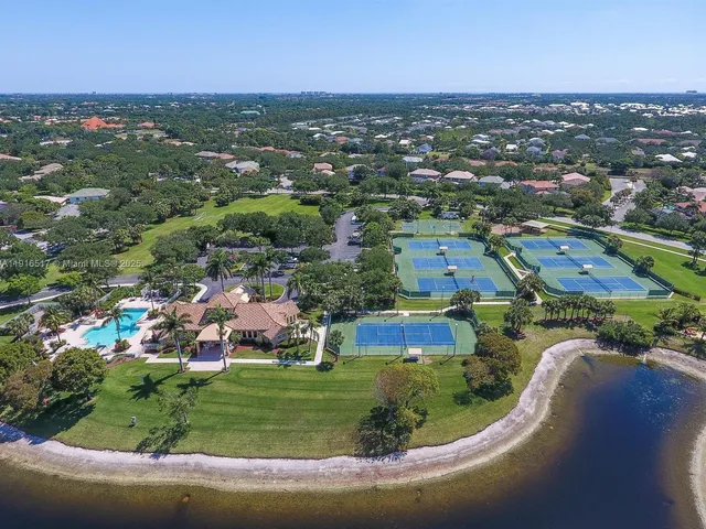 a view of a swimming pool with a yard