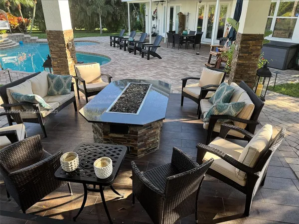 a outdoor living space with furniture and rug
