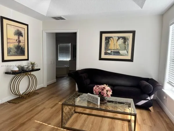 a living room with furniture and a rug